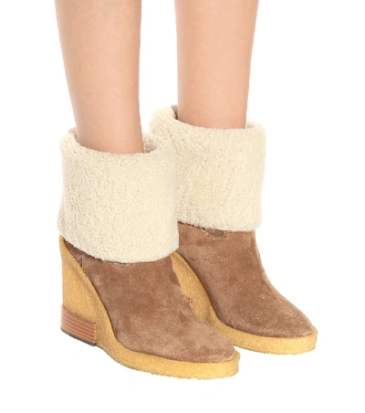 Shop Tod's Suede Wedge Ankle Boots In Beige