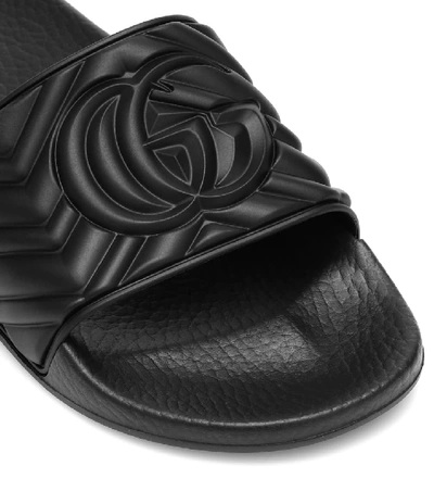 Shop Gucci Embossed Slides In Black