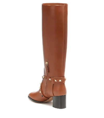 Shop Valentino Rockstud Riding Leather Knee High Boots In Brown