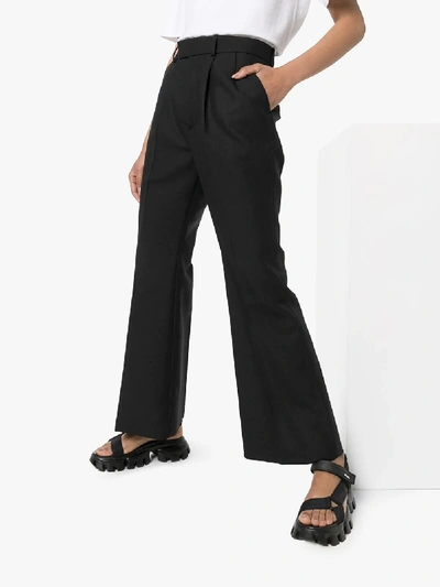 Shop Gucci Red Label Flared Wool Trousers In Black