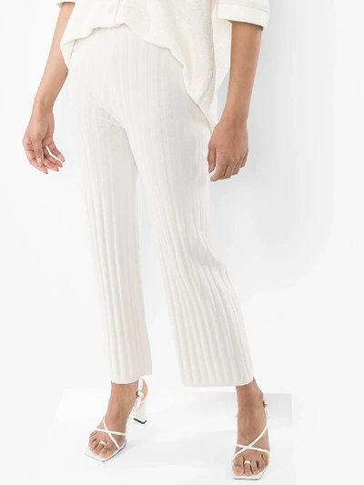 Shop Totême Cour Ribbed Knit Trousers In Neutrals