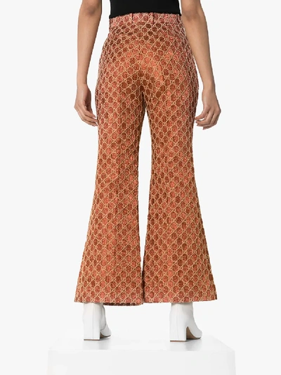 Shop Gucci Gg Jacquard Flared Trousers In Orange