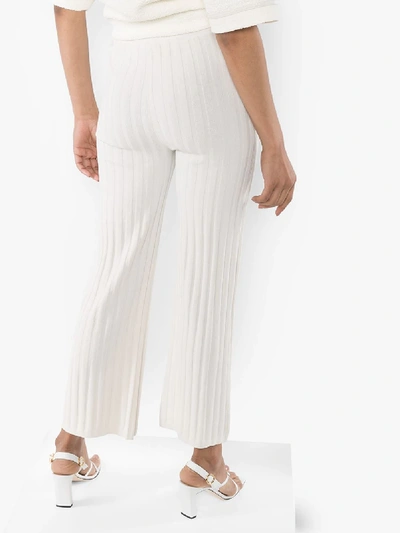 Shop Totême Cour Ribbed Knit Trousers In Neutrals