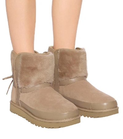 Shop Ugg Classic Bow Shearling Suede Boots In Beige