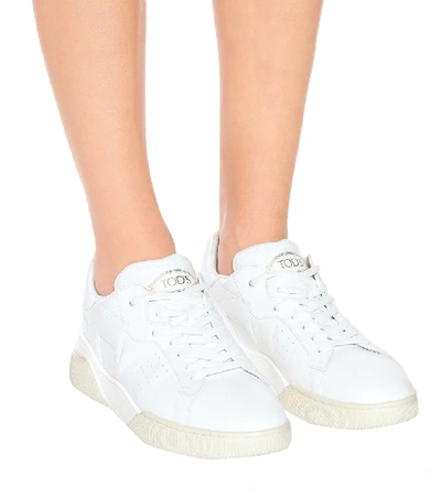 Shop Tod's Leather Sneakers In White