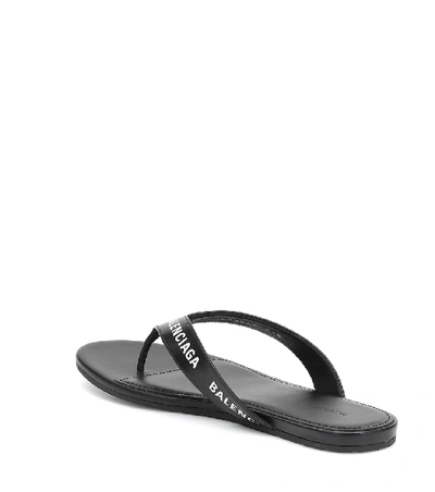 Shop Balenciaga Logo Leather Thong Sandals In Black