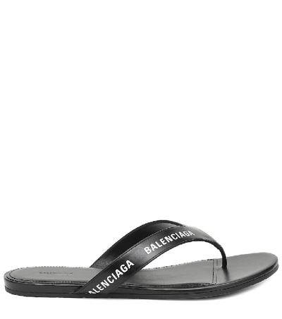 Shop Balenciaga Logo Leather Thong Sandals In Black
