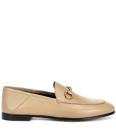 Shop Gucci Horsebit Leather Loafers In Beige
