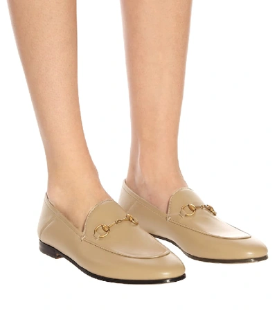 Shop Gucci Horsebit Leather Loafers In Beige