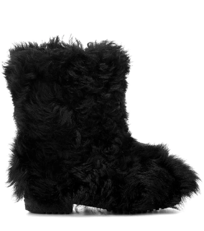Shop Saint Laurent Shearling Ankle Boots In Black