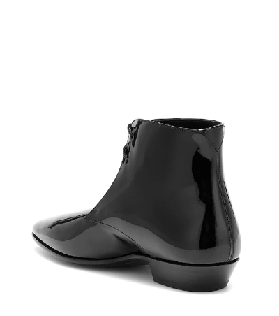 Shop Saint Laurent Jonas Patent Leather Ankle Boots In Black