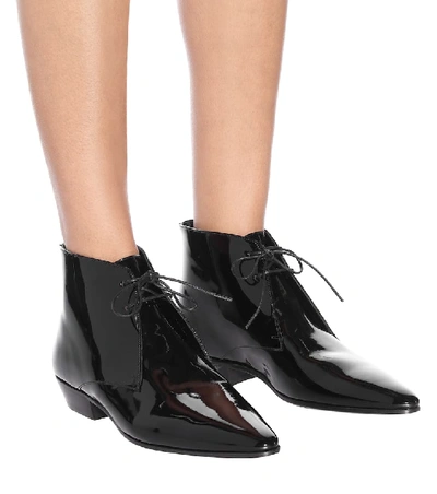 Shop Saint Laurent Jonas Patent Leather Ankle Boots In Black