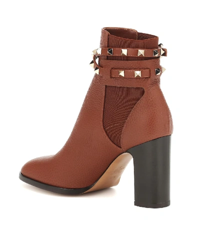 Shop Valentino Rockstud Leather Ankle Boots In Brown