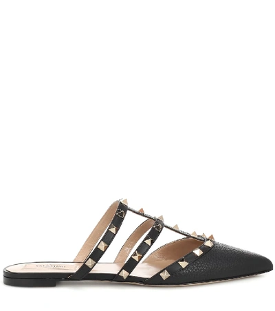Shop Valentino Rockstud Leather Slippers In Black