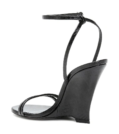 Shop Saint Laurent Kym Snakeskin Sandals In Black