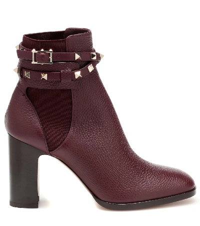 Shop Valentino Rockstud Leather Ankle Boots In Purple