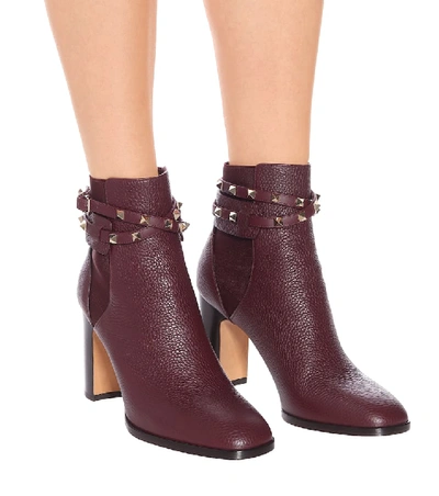 Shop Valentino Rockstud Leather Ankle Boots In Purple