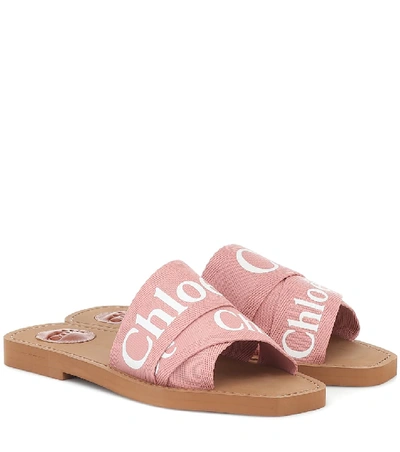 Shop Chloé Woody Canvas Slides In Pink