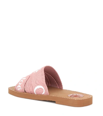 Shop Chloé Woody Canvas Slides In Pink