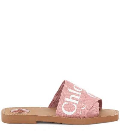 Shop Chloé Woody Canvas Slides In Pink