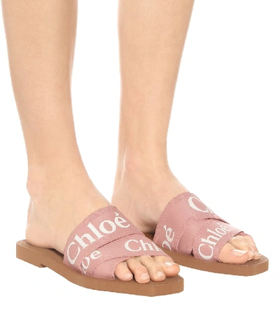 Shop Chloé Woody Canvas Slides In Pink