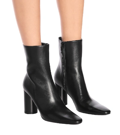 Shop Balenciaga Oval Leather Ankle Boots In Black