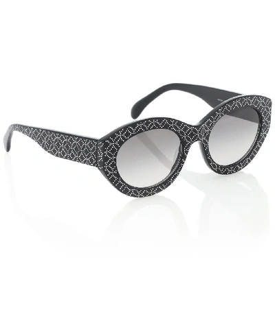 Shop Alaïa Embellished Oval Sunglasses In Black