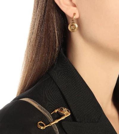 Shop Versace Medusa Earrings In Gold