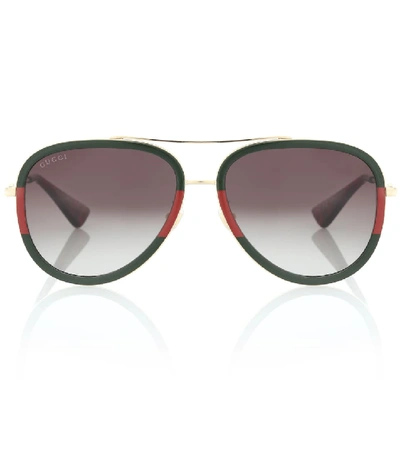 Shop Gucci Aviator Sunglasses In Gold