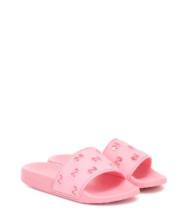 Shop Gucci Gg Embossed Rubber Slides In Pink