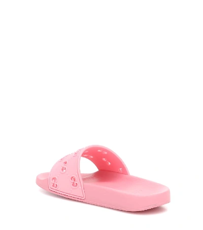 Shop Gucci Gg Embossed Rubber Slides In Pink