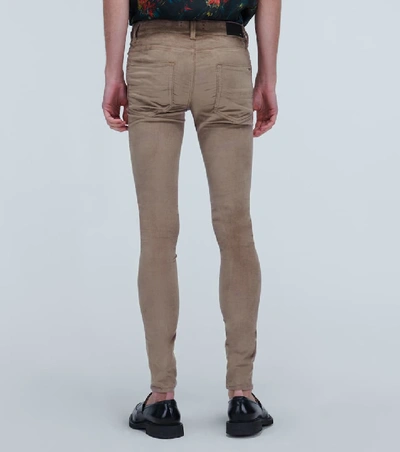 Shop Amiri Skinny-fit Velour Stack Pants In Beige