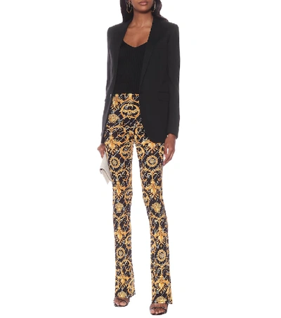 Shop Versace Printed Stretch-jersey Pants In Black