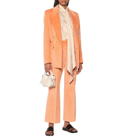 Shop Acne Studios High-rise Flared Corduroy Pants In Orange