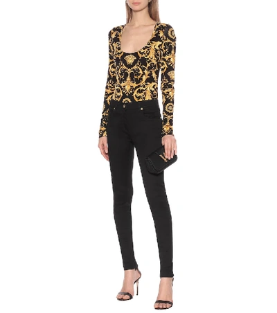 Shop Versace Stretch-cotton Skinny Jeans In Black