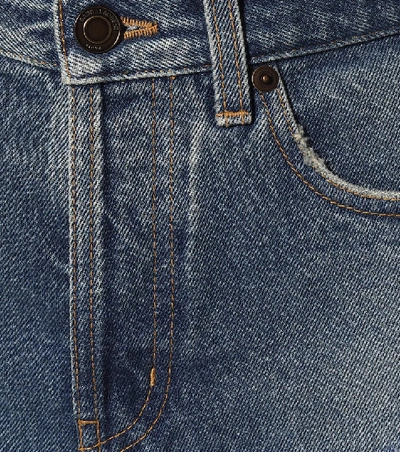 Shop Saint Laurent Feather-trimmed Denim Shorts In Blue
