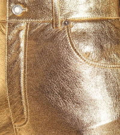 Shop Saint Laurent Metallic Leather Shorts In Gold