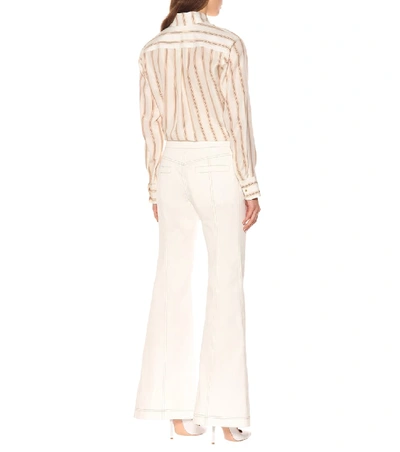 Shop Chloé High-rise Flared Jeans In White