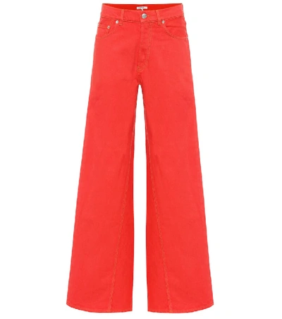 Shop Ganni High-waisted Flared Jeans In Red