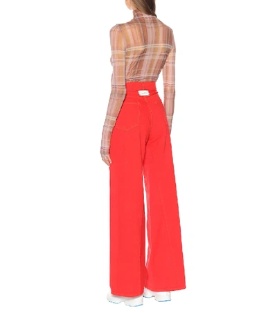 Shop Ganni High-waisted Flared Jeans In Red