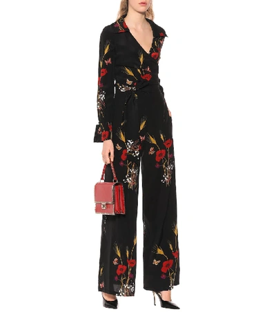 Shop Valentino Floral-printed Silk Jumpsuit In Black