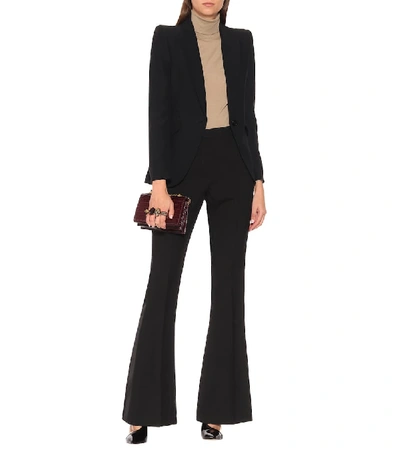 Shop Alexander Mcqueen Mid-rise Flared Wool-blend Pants In Black