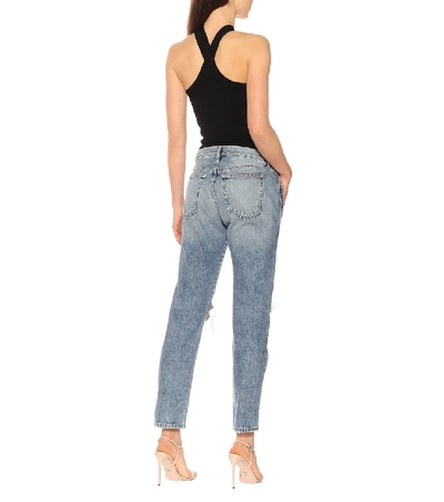 Shop Khaite The Kyle Low-rise Distressed Jeans In Blue