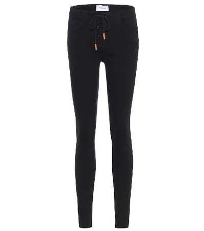 Shop Frame Le Skinny De Jeanne Mid-rise Jeans In Black