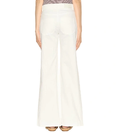 Shop Chloé Flared High-rise Jeans In White