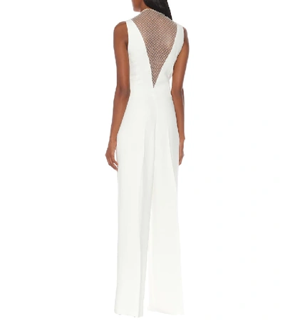 Shop Stella Mccartney Embellished Crêpe Jumpsuit In White