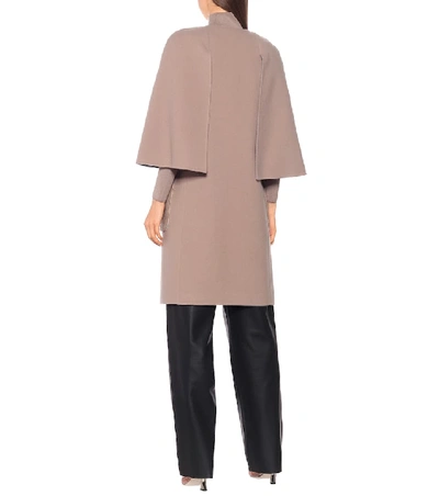 Shop Fendi Shearling-trimmed Virgin Wool Coat In Beige