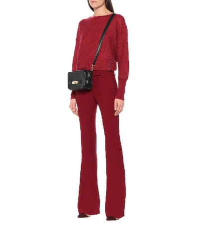 Shop Alexander Mcqueen Mid-rise Flared Pants In Red