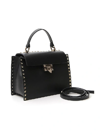 Shop Valentino Garavani Rockstud Top Handle Shoulder Bag In Black