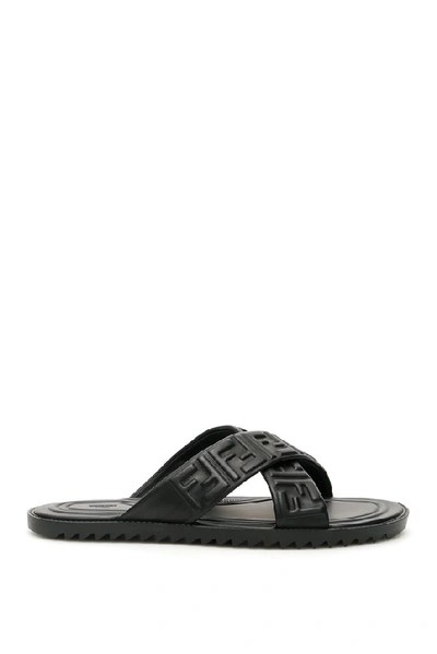 Shop Fendi Ff Logo Embossed Sandals In Black